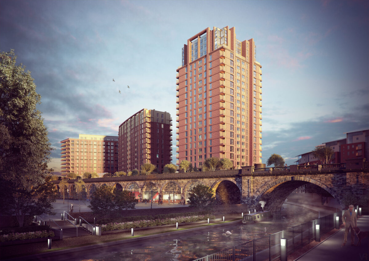 A tall apartment block in the background, with a canal and arched bridge in the foreground.